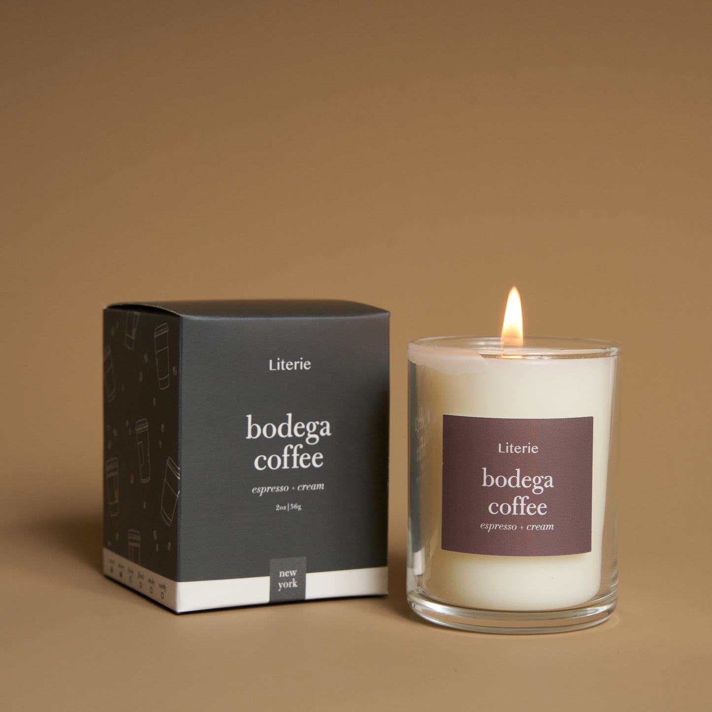 bodgea coffe 2 ounce candle with box on a brown background.