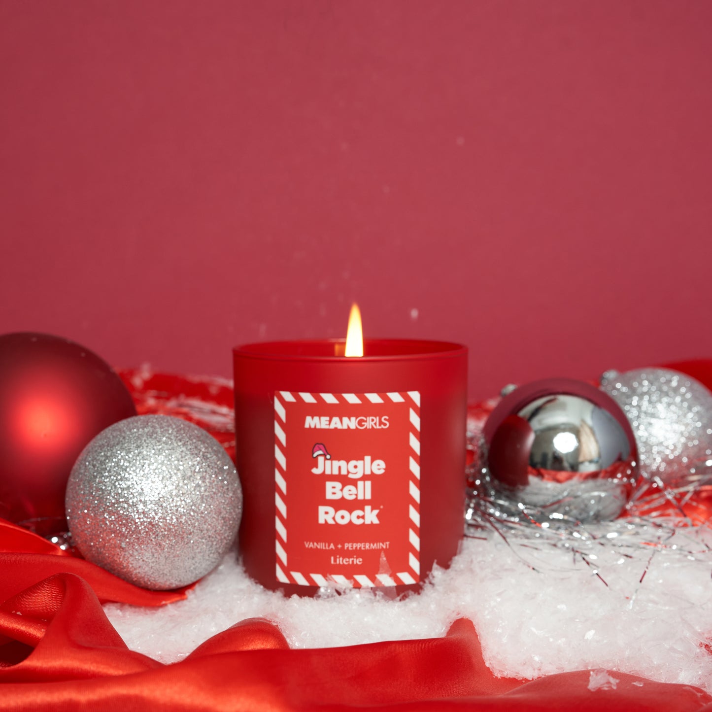 Mean Girls jingle bell rock candle with ornaments.