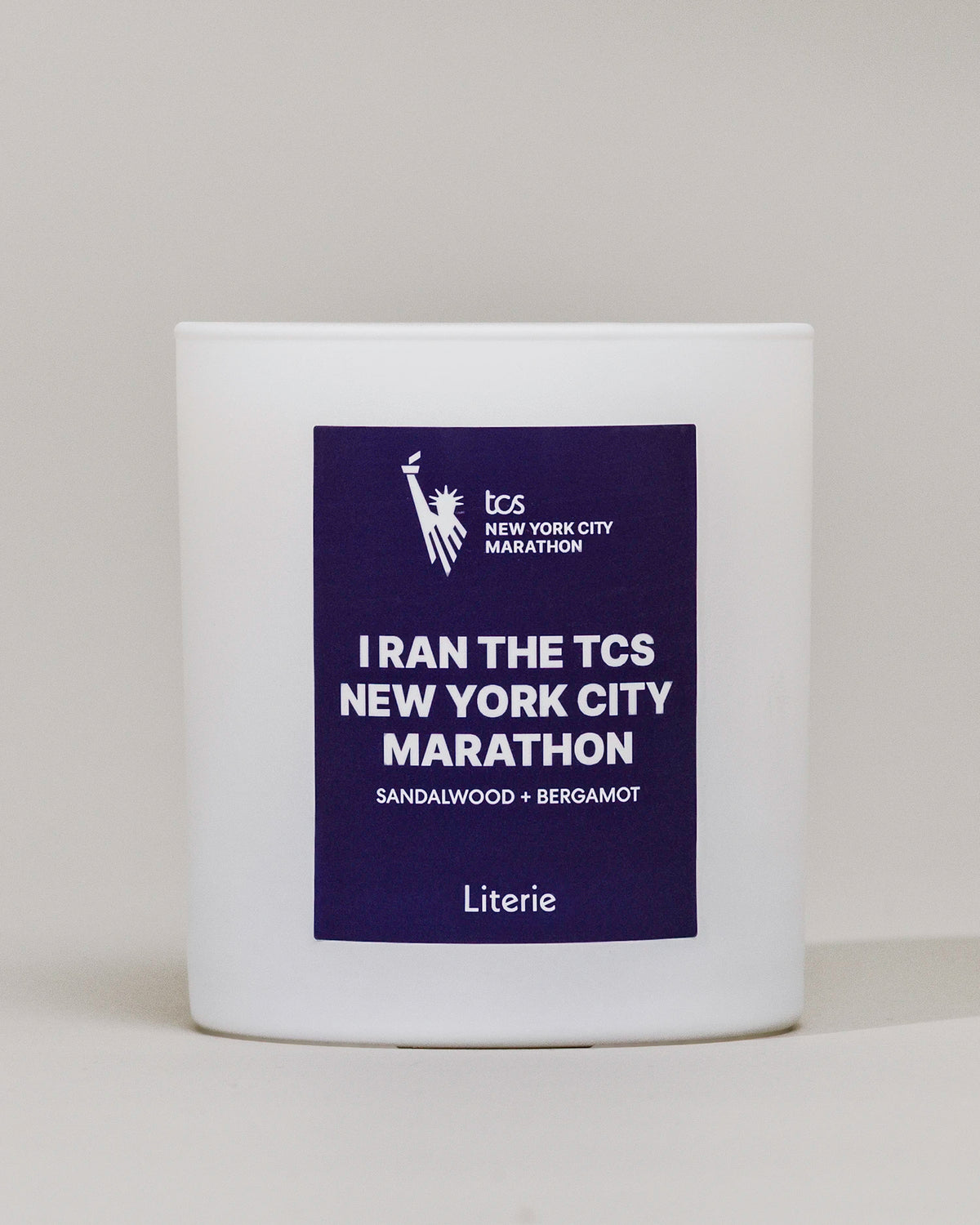 I Ran The TCS New York City Marathon candle on a white background.