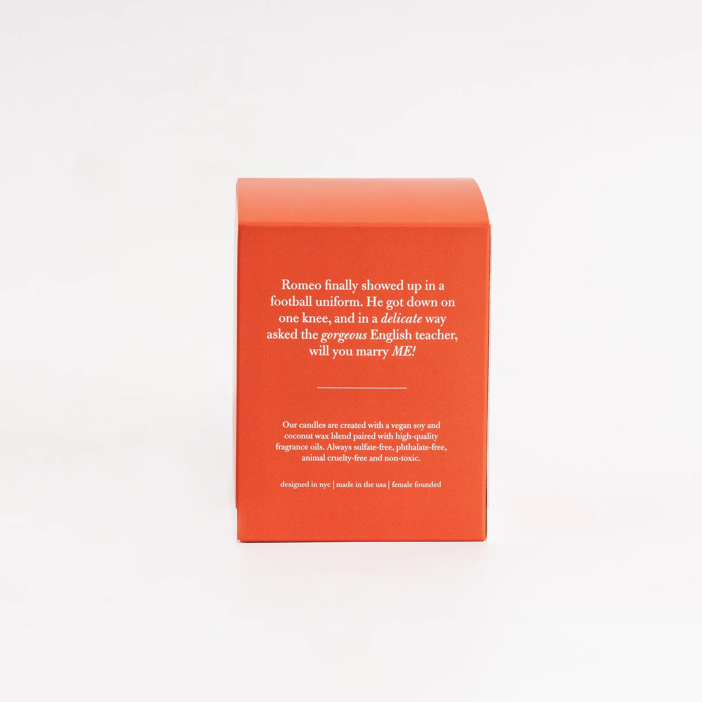 Red candle box with text on a white background