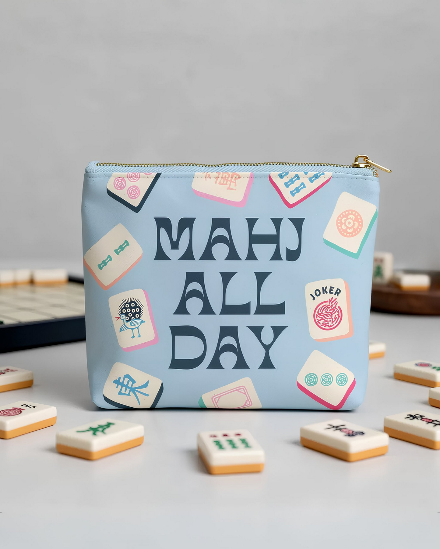 Pouch with 'Mah All Day' text and mahjong tile design on a gray background