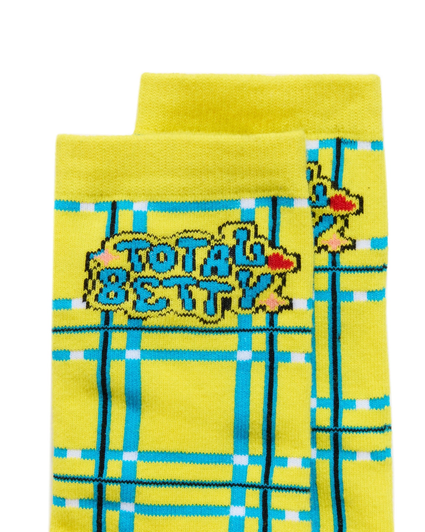 Yellow Cluless socks with plaid pattern and 'Total Betty' text on a white background