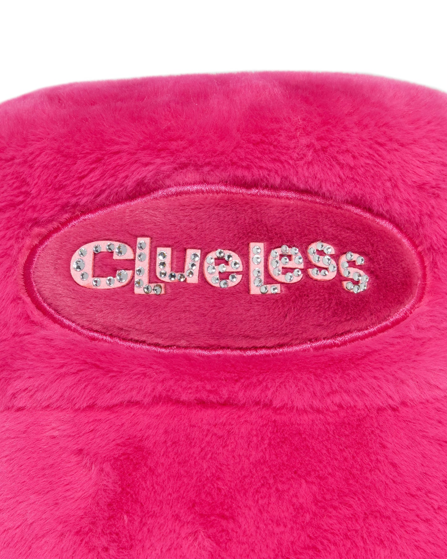 Pink plush toy with 'Clueless' text on a white background