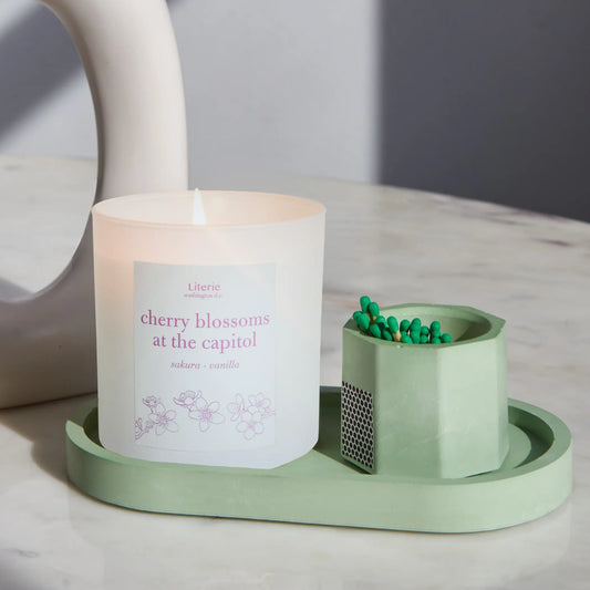 cherry blossoms at the captiol candle with matcha tray and matches.