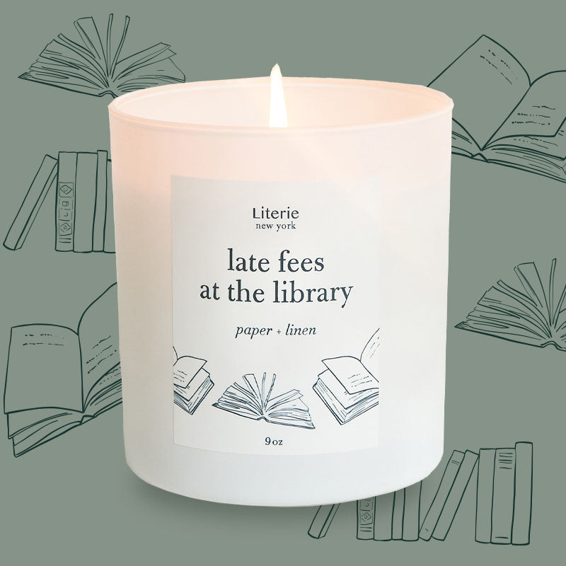 late fees at the library candle with illustration of books.