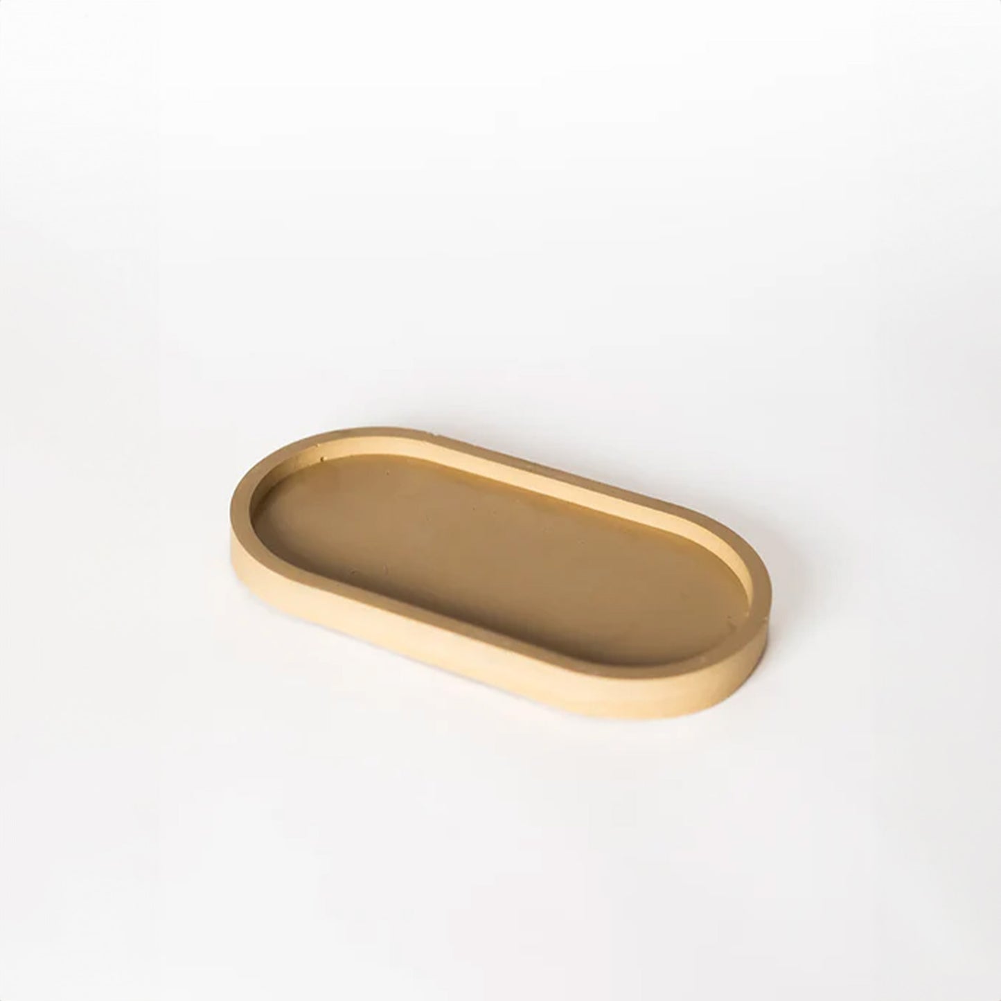 Taupe pill shaped candle tray.