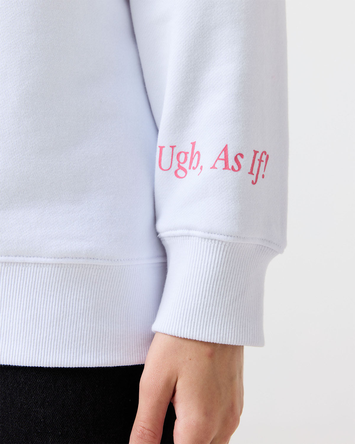 White sweatshirt sleeve with pink text 'Ugh, As If!' on a white background