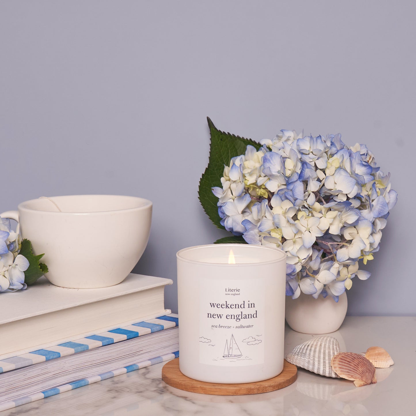 Weekend in new england candle with hydrangeas.