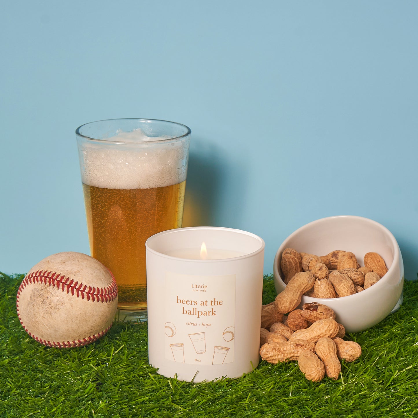 Beers at the ballpark candle with a baseball and roasted nuts.