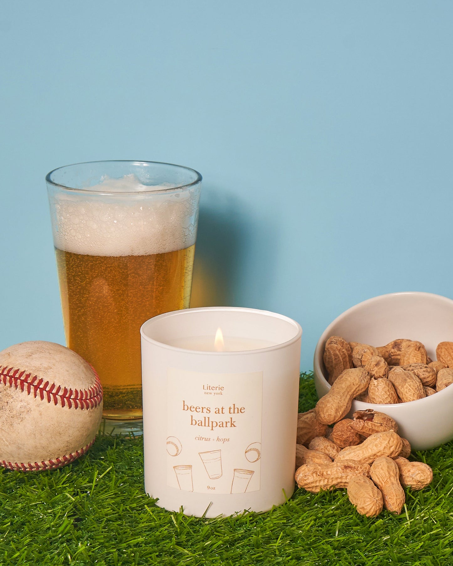 Beers at the ballpark candle with a baseball and roasted nuts.