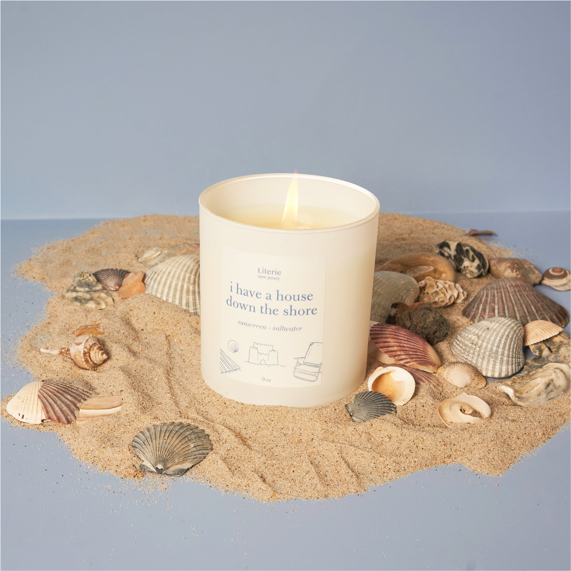 I have a house down the shore candle with seashells.