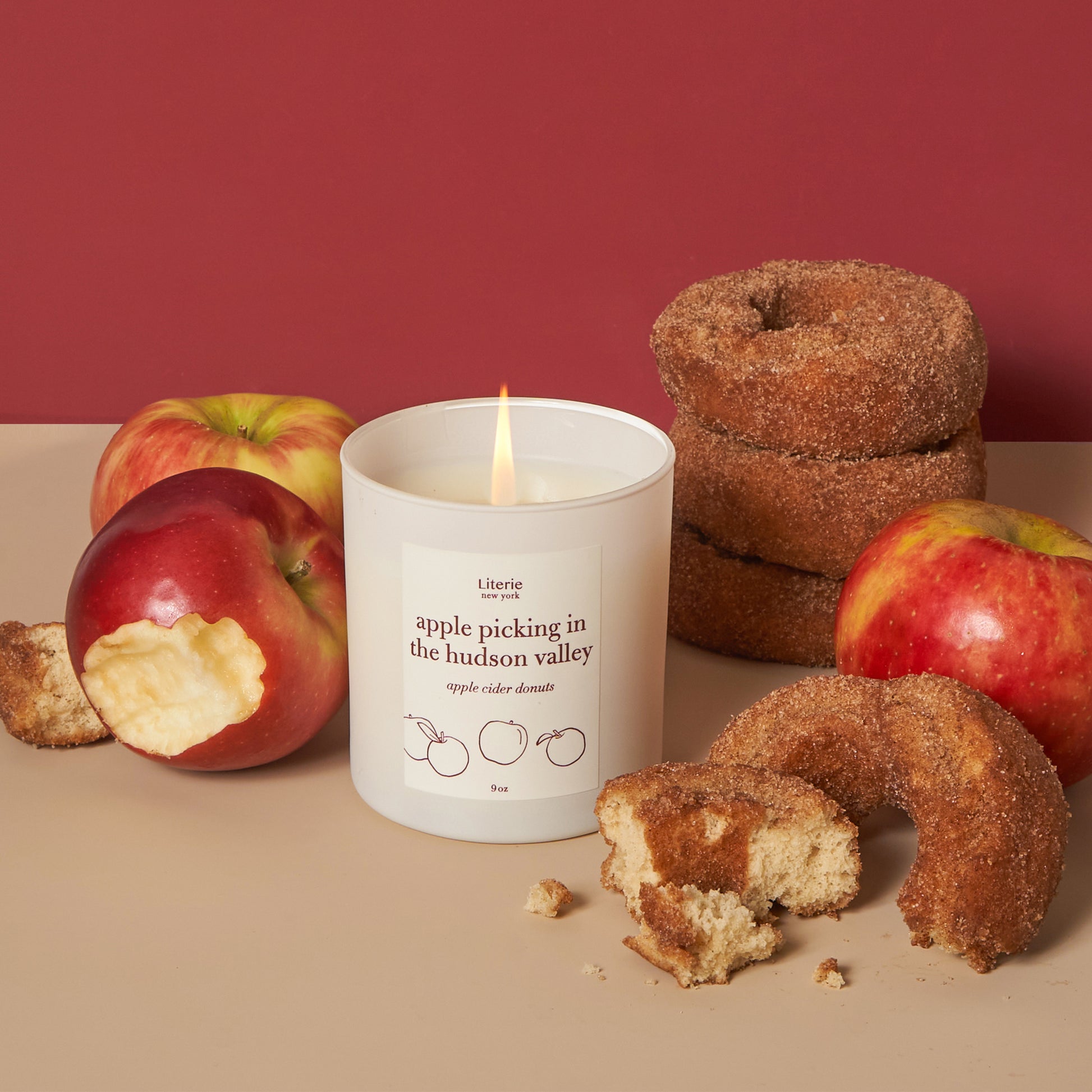 Apple picking in the hudson valley candle with apples and donuts.