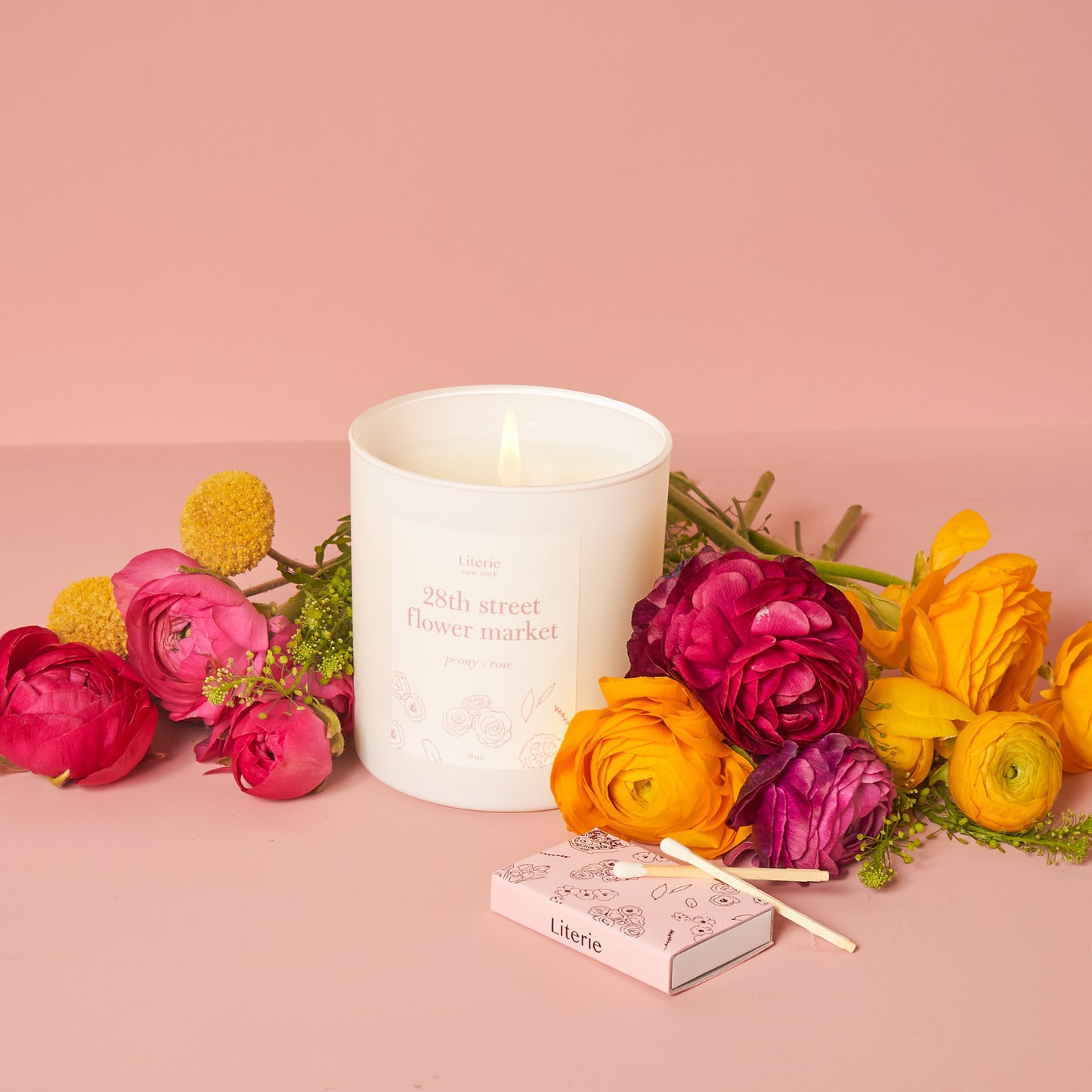 28th street flower market candle with matches and flowers.