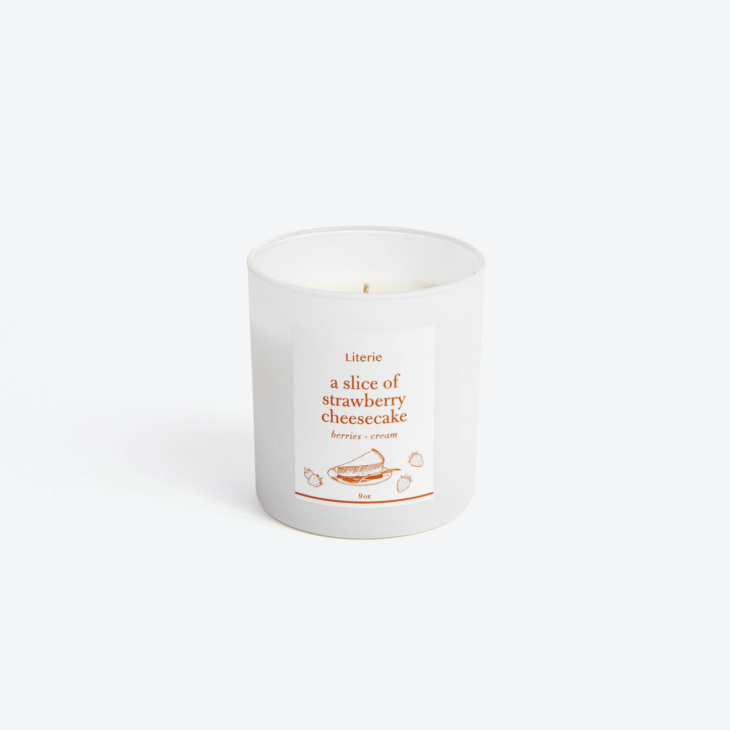 Cheesecake candle on white background.