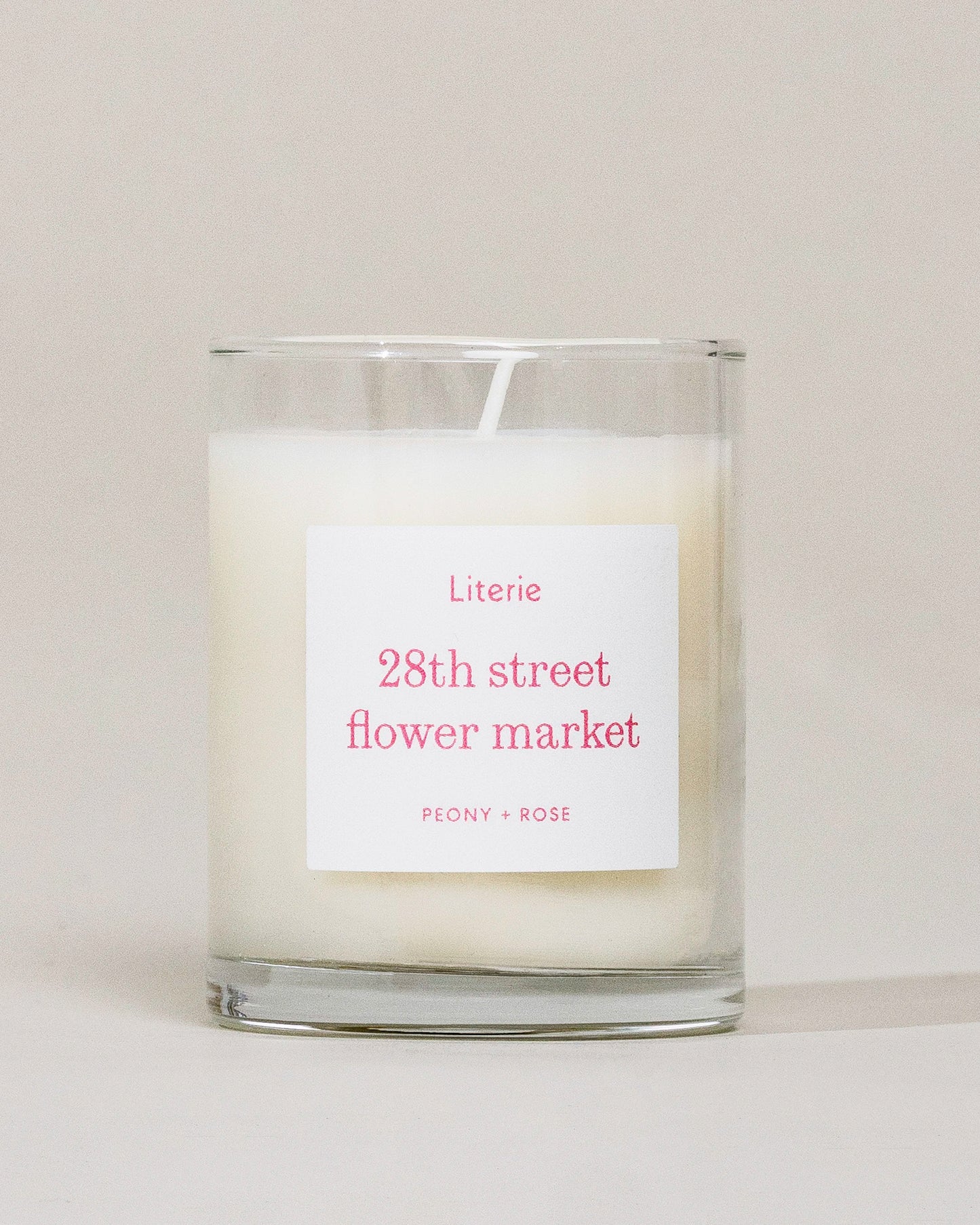 28th Street Flower Market (Little) candle on a grey background.