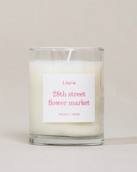 28th Street Flower Market (Little) candle on a grey background.