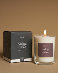 bodgea coffe 2 ounce candle with box on a brown background.