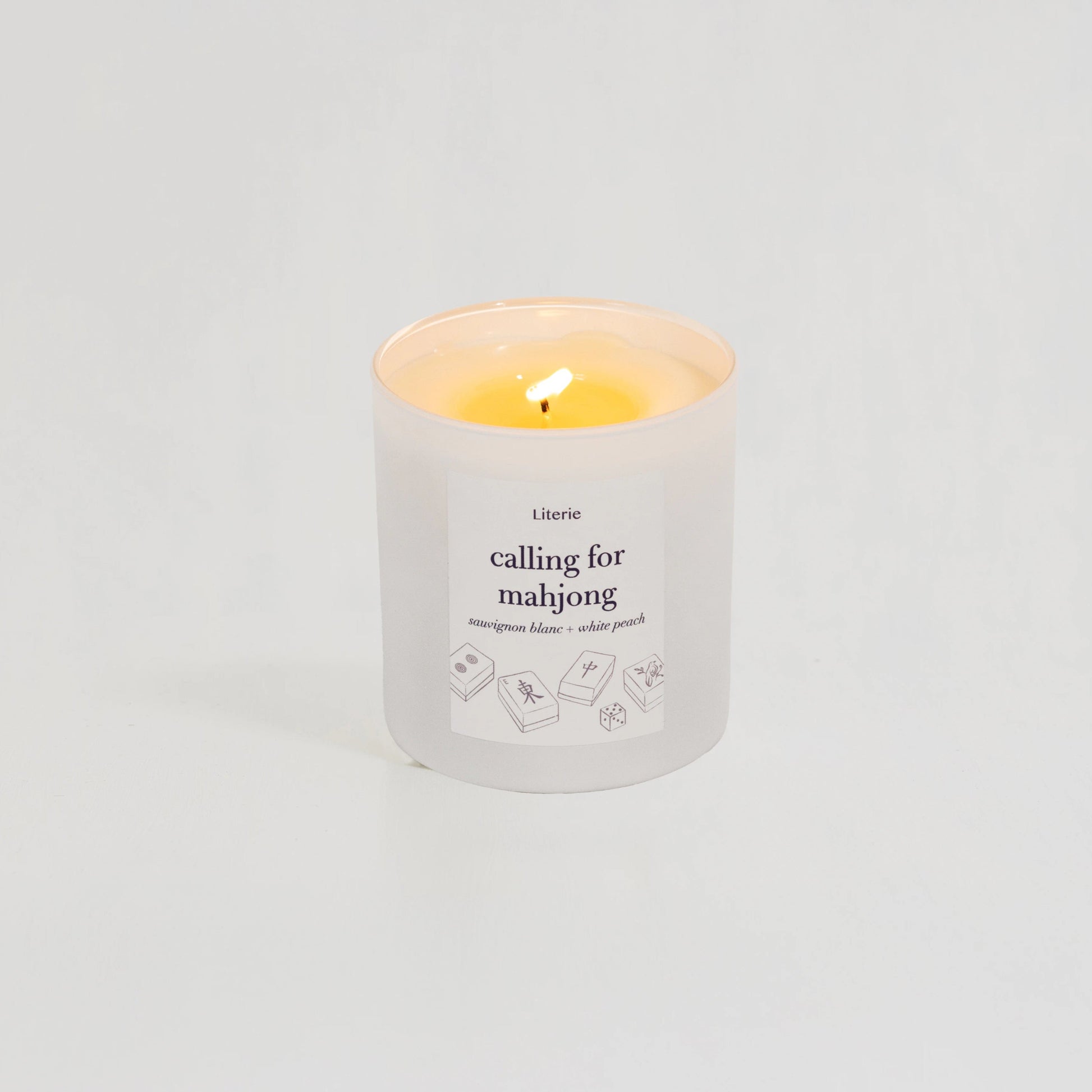 Literie's "calling for mahjong" sauvignon blanc + white peach candle.