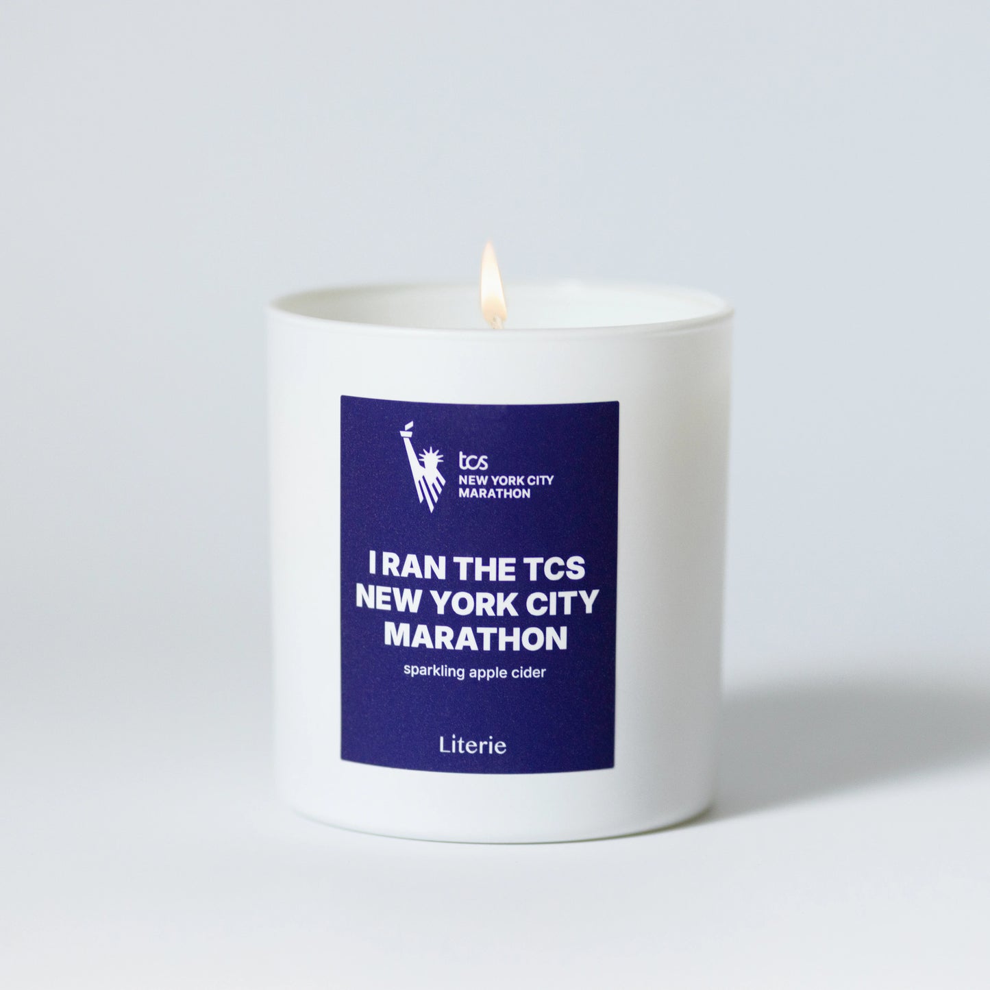 I Ran The TCS New York City Marathon candle on a white background.