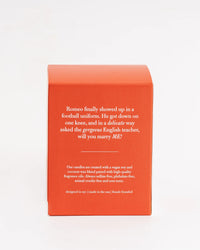 Red candle box with text on a white background