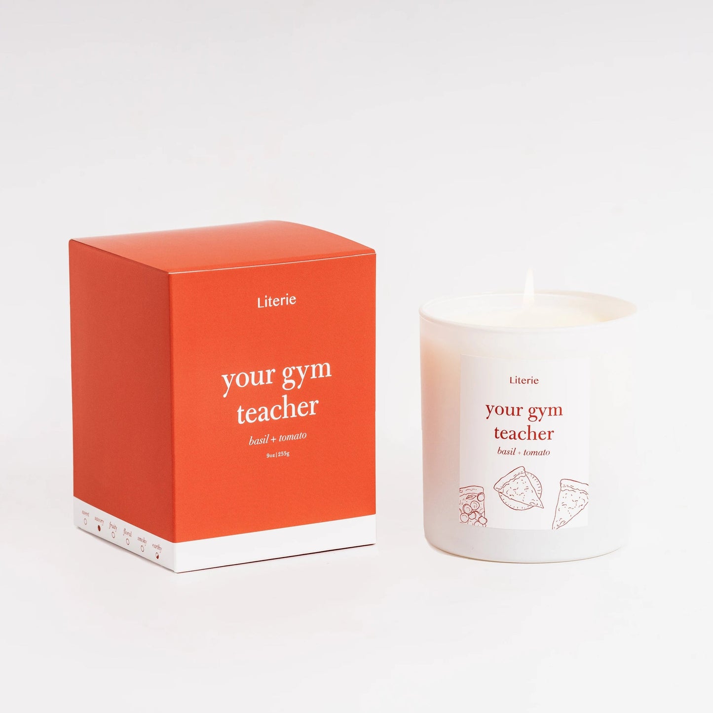Candle and packaging with 'your gym teacher' text on a white background