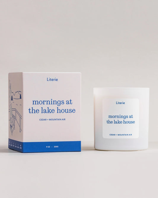 Literie candle and packaging with 'mornings at the lake house' text on a neutral background