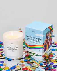 marching in the Pride parade candle with box.