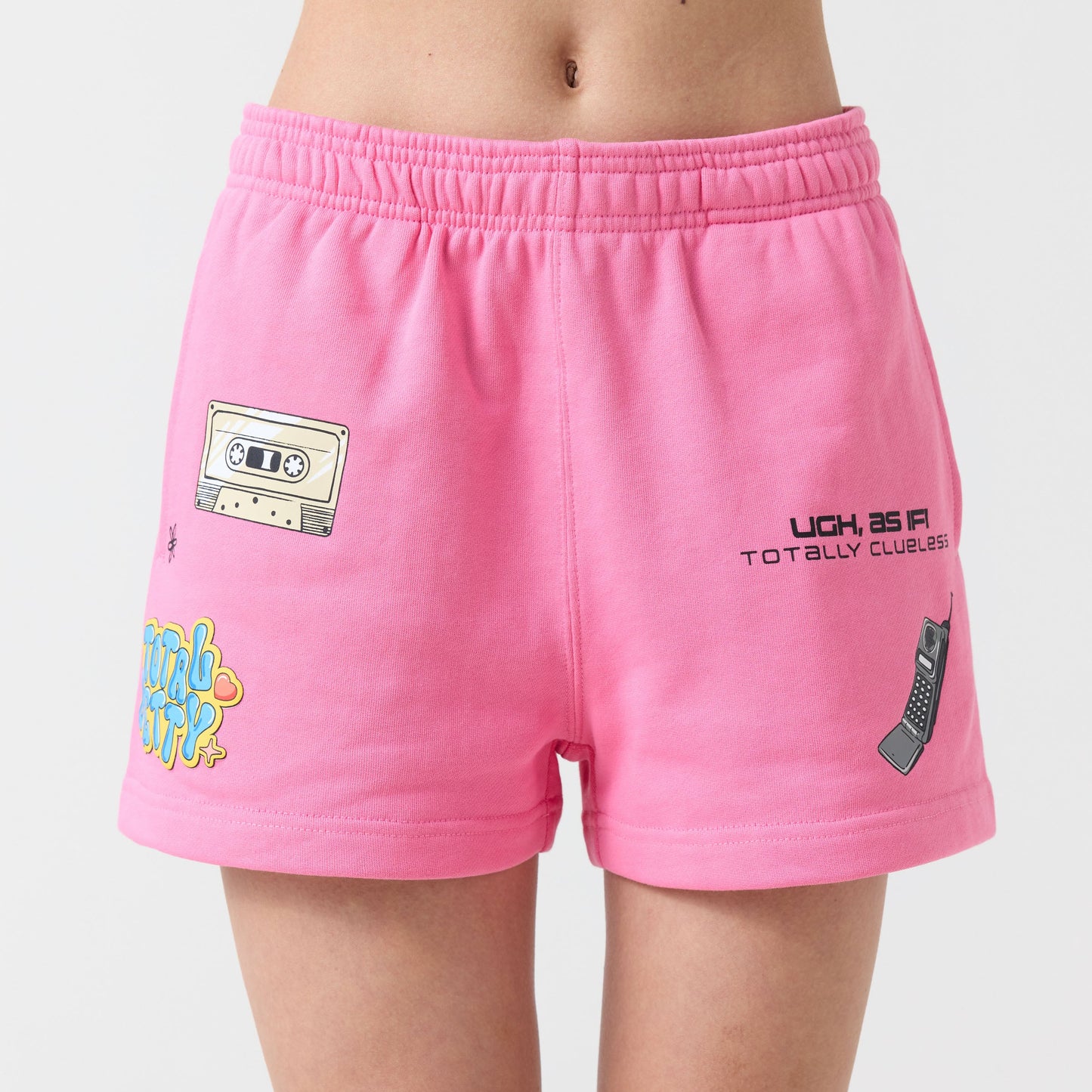 Pink shorts with various designs on a plain background