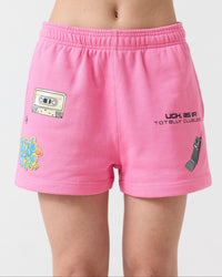 Pink shorts with various designs on a plain background