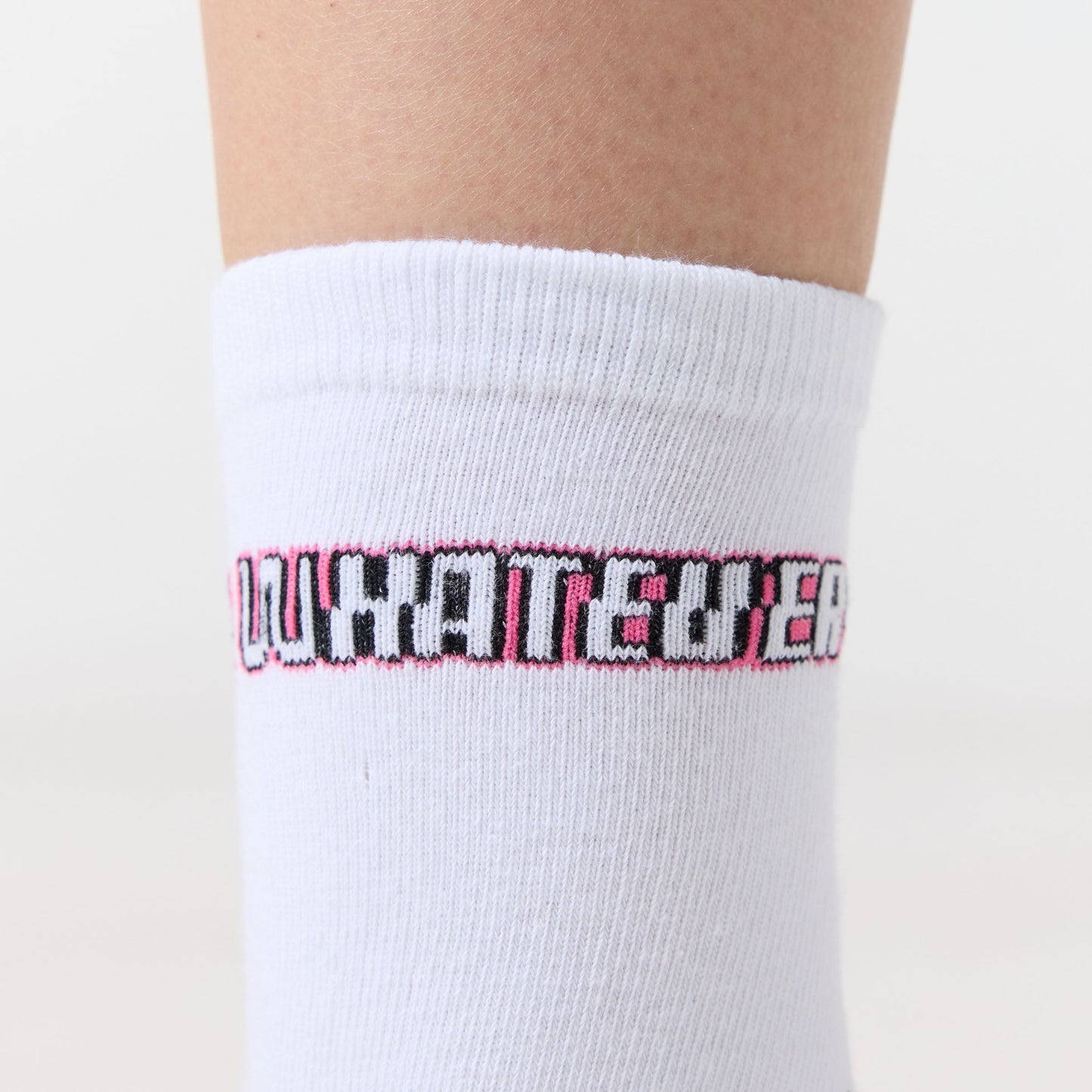 White sock with pink and black text on a white background