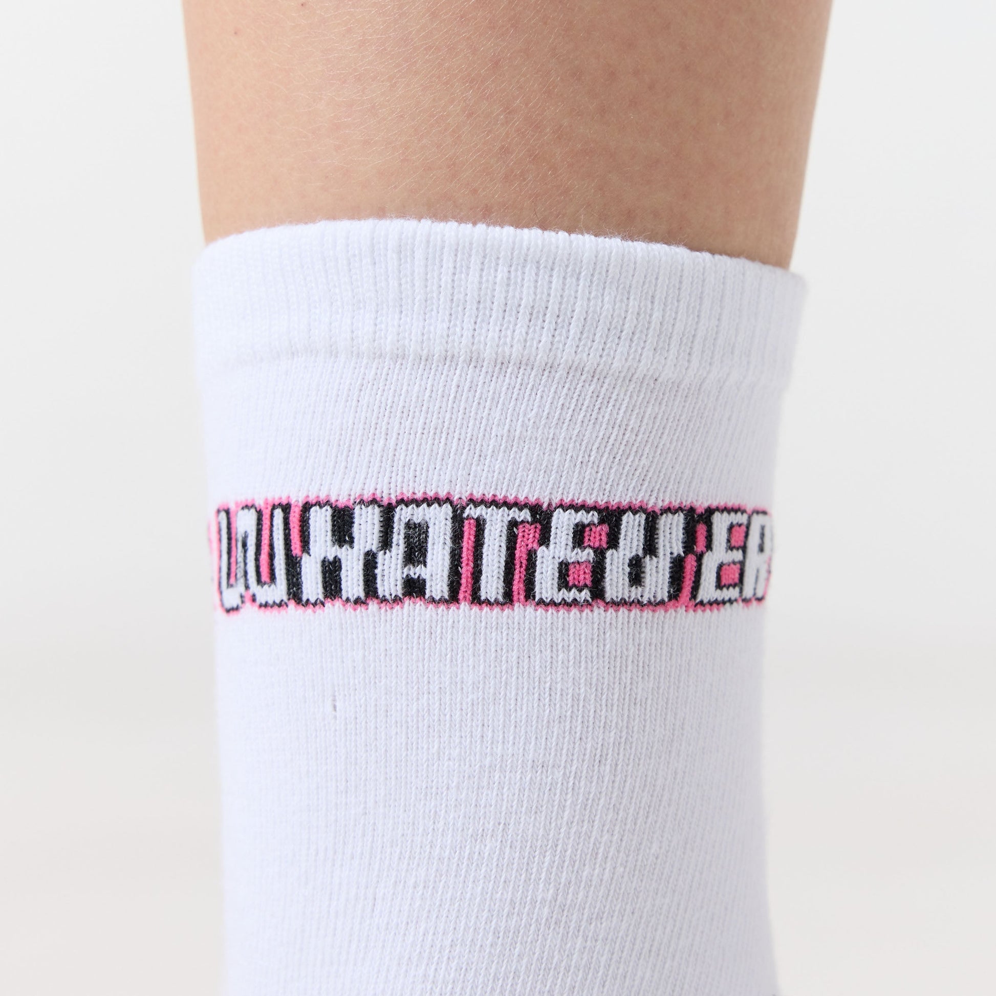 White sock with pink and black text on a white background