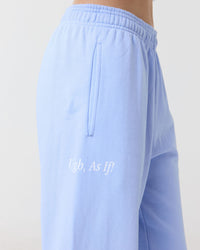 Light blue pants with text saying "Ugh, as if!" on a plain background