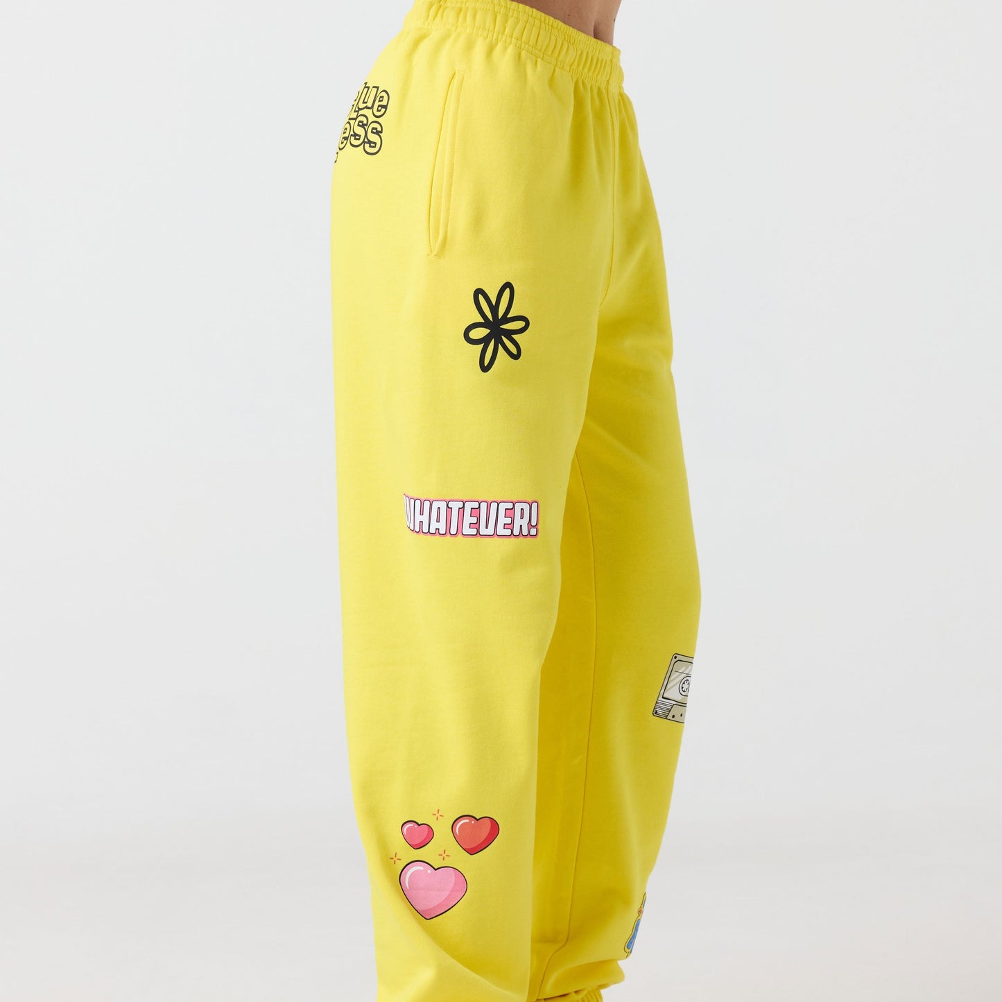 Yellow pants with various designs and text on a white background