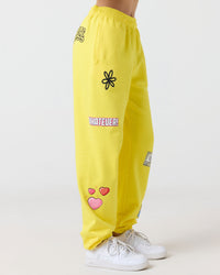 Yellow pants with various designs and text on a white background