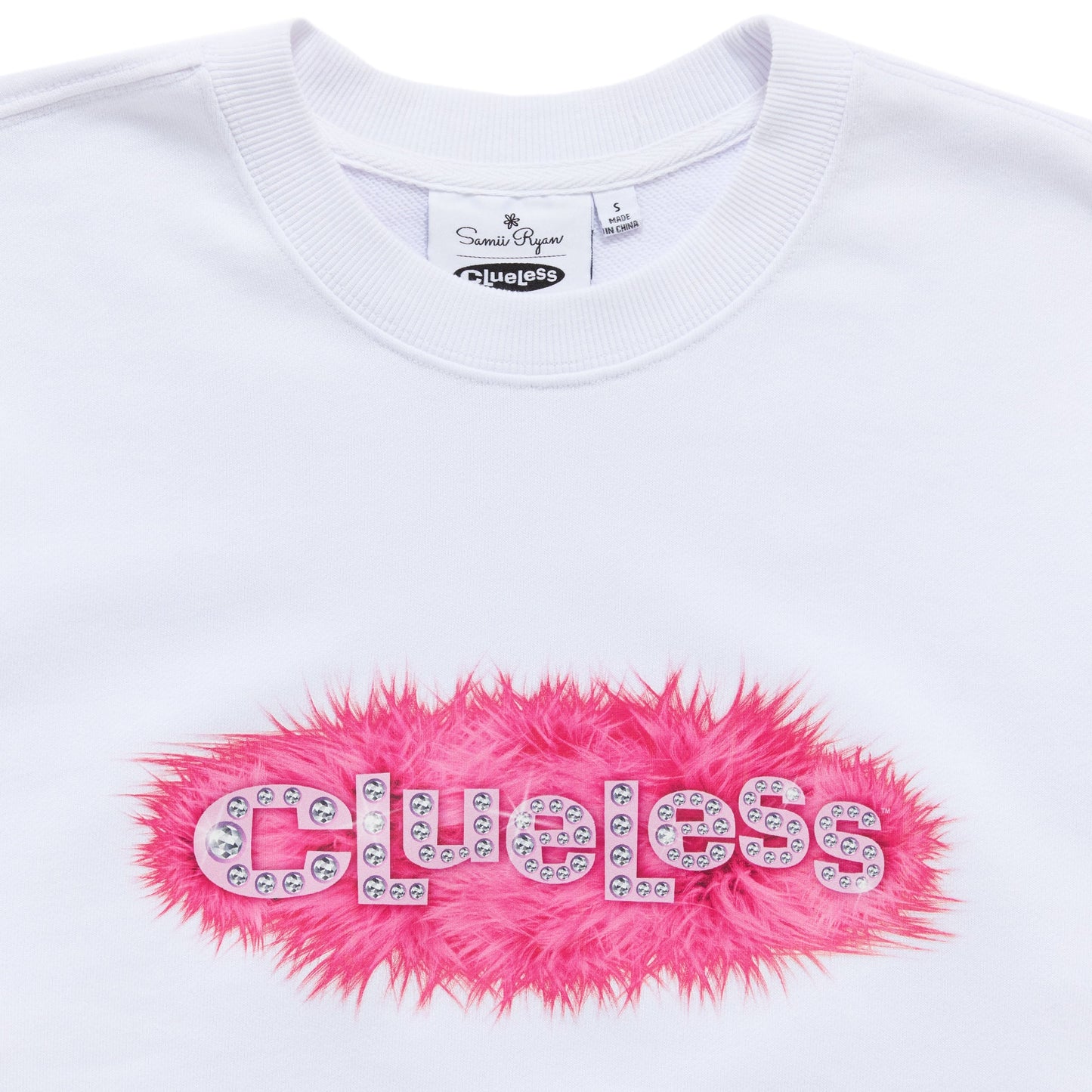 White sweatshirt with pink fluffy logo and 'Clueless' text on a white background