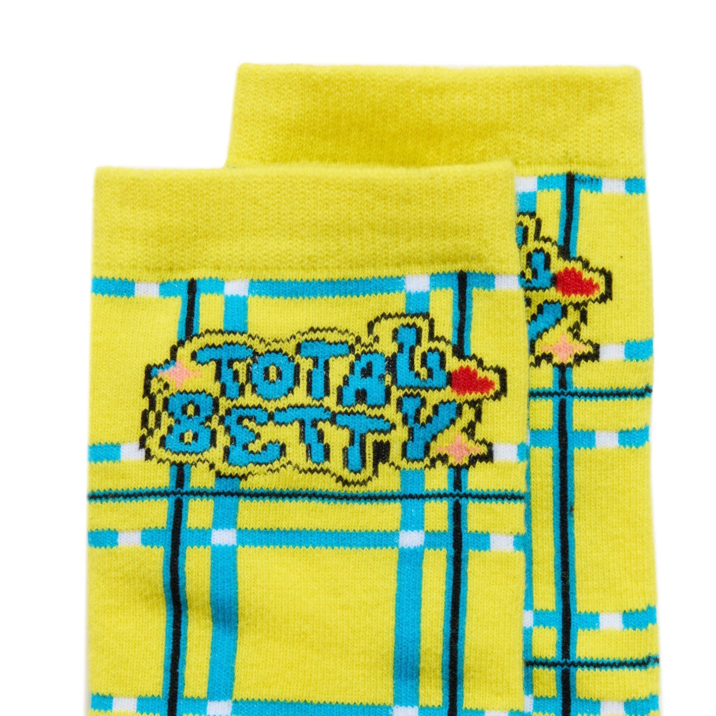 Yellow Cluless socks with plaid pattern and 'Total Betty' text on a white background