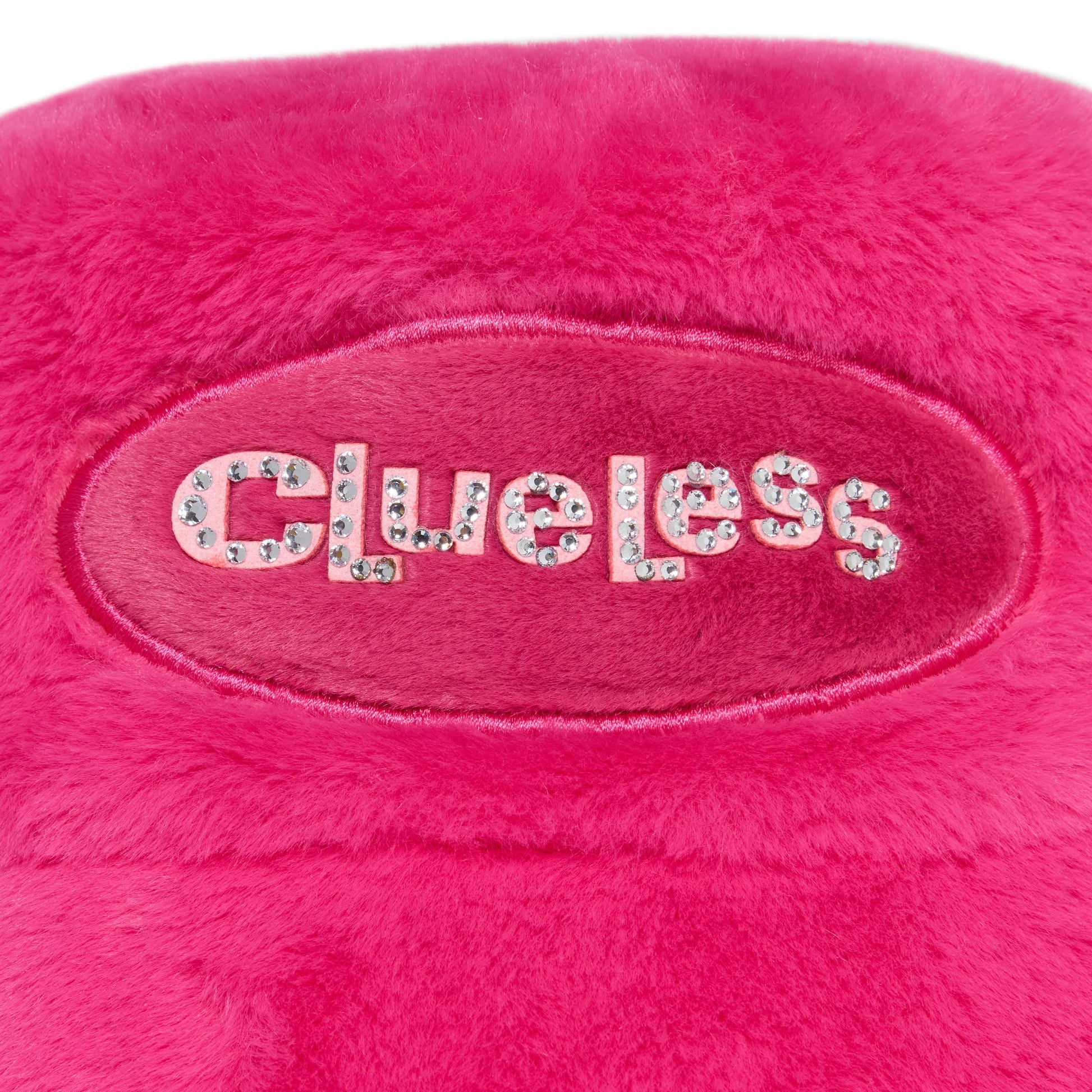Pink plush toy with 'Clueless' text on a white background