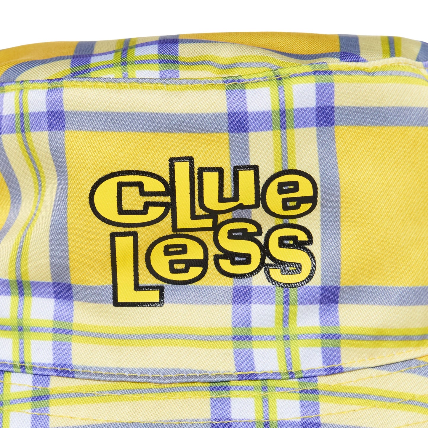 Yellow plaid fabric with 'Clueless' text in black