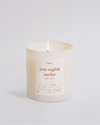 Candle that says your english teacher on it in orange.
