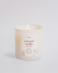 Candle with text 'Your gym teacher' on a white background