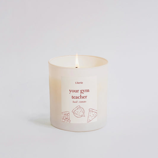 Candle with text 'Your gym teacher' on a white background