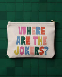 White pouch with colorful text 'WHERE ARE THE JOKERS?' on a green tiled background