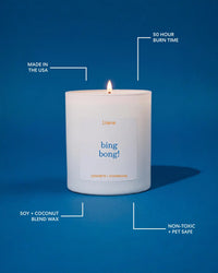 A lit white candle in a white glass jar on a blue background with callout lines and text highlighting product features: 'Made in the USA,' '50 Hour Burn Time,' 'Soy + Coconut Blend Wax,' and 'Non-Toxic + Pet Safe.' The front label reads 'Literie' and 'bing bong!' with 'Concrete + Champagne' below.