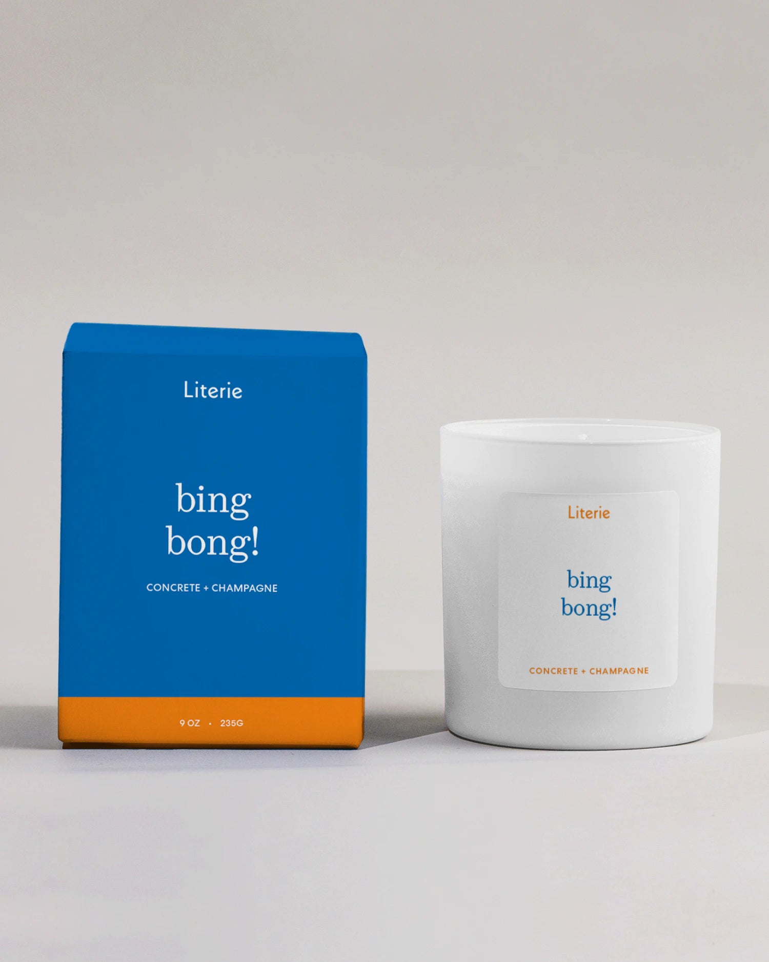 Literie bing bong! Knicks -inspired candle and packaging on a light gray background
