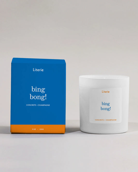 Literie bing bong! Knicks -inspired candle and packaging on a light gray background