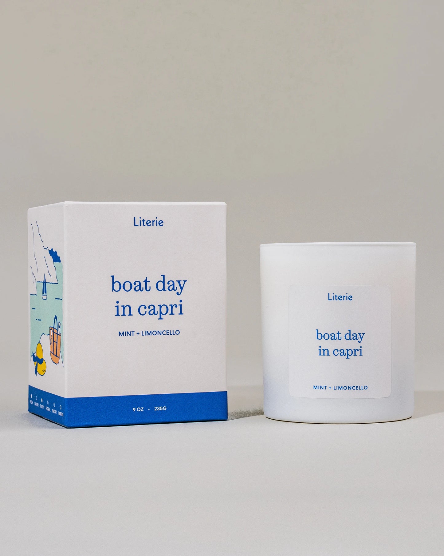 Candle and packaging of 'boat day in capri' by Literie on a light gray background