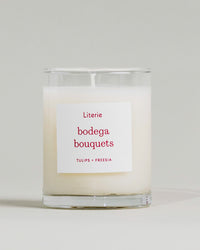 "Bodega Bouquets" little candle by Literie on a grey background.