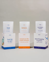 Euro summer collection of candles with boxes against a gray background