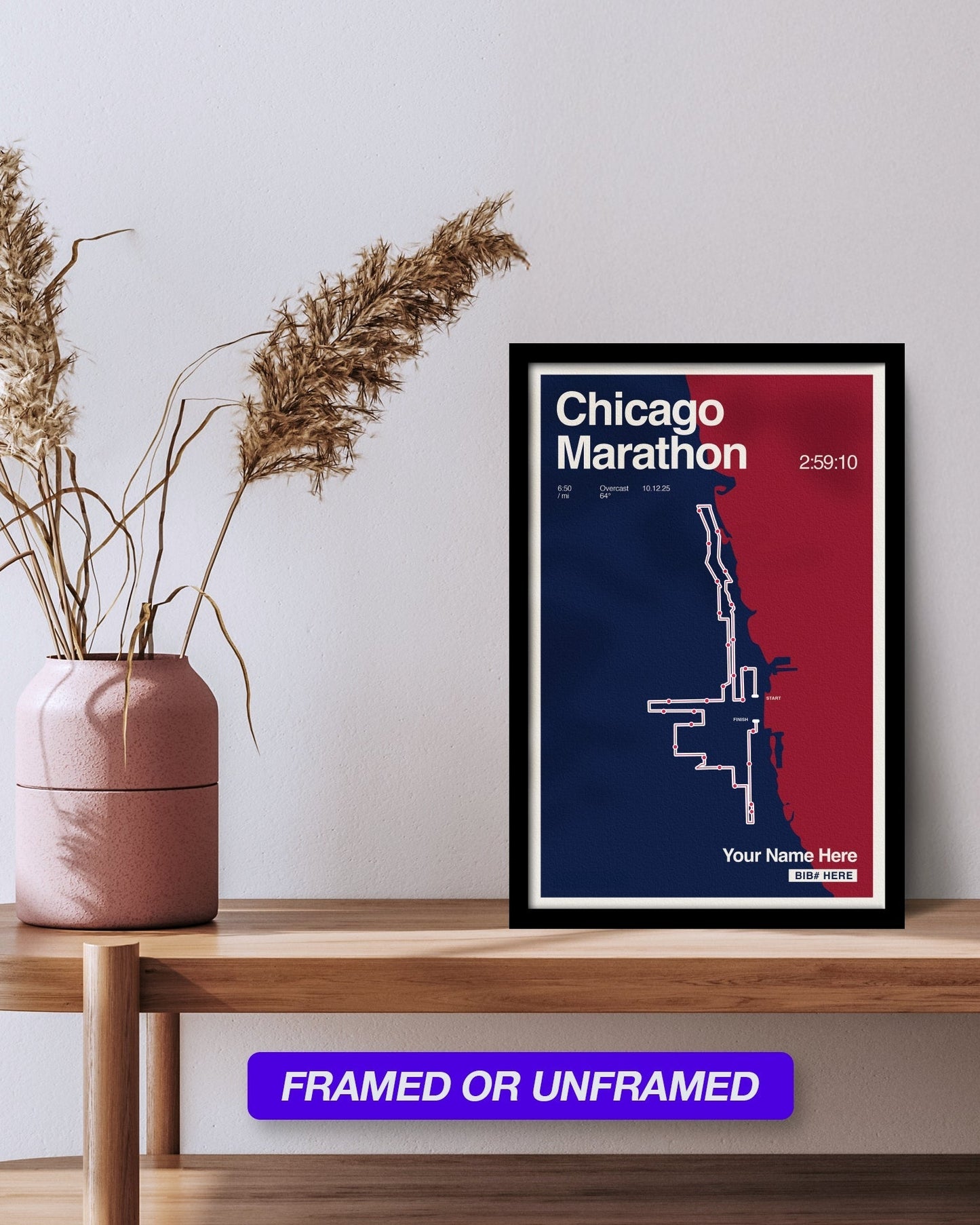 Framed Chicago Marathon poster on a wooden shelf with a vase and dried plants.