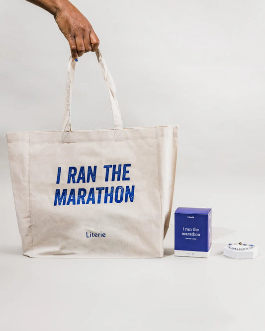 The Finish Line collection by Literie with tote bag, candle and bracelet.